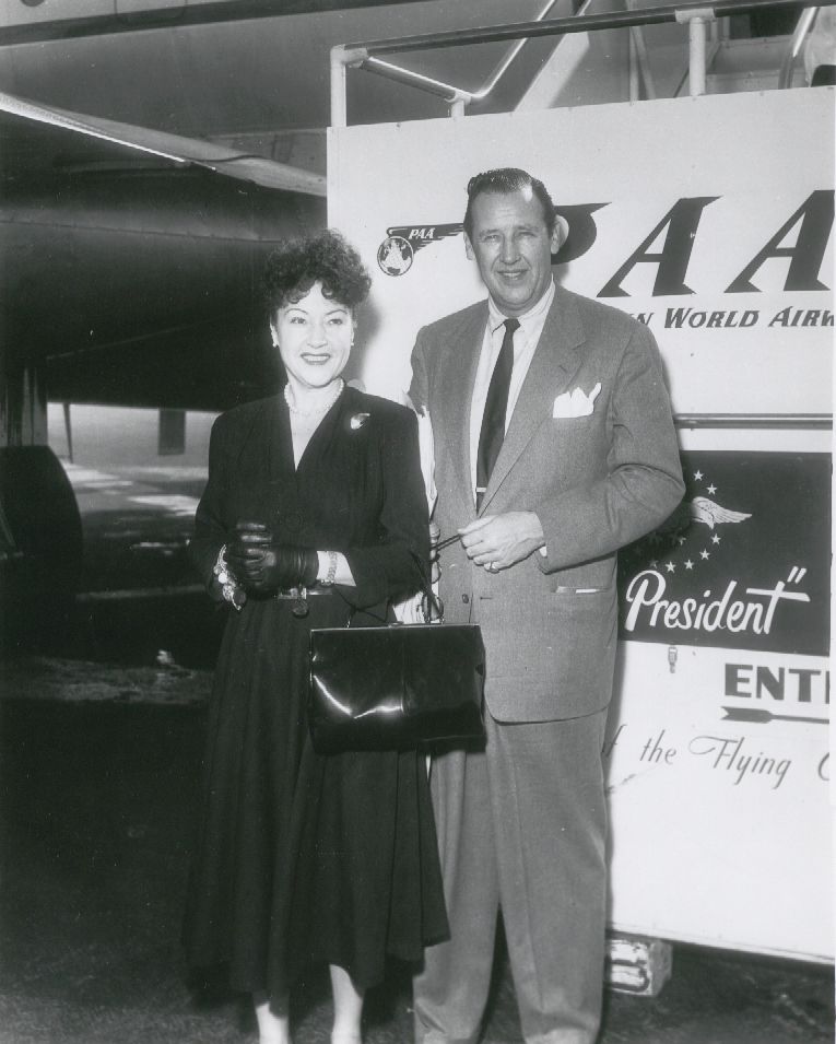 1954 Ethel Merman & husband Ed Six pose by a Pan Am Stratocruiser.